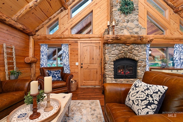 living area with plenty of natural light, wooden ceiling, wood finished floors, wood walls, and a fireplace