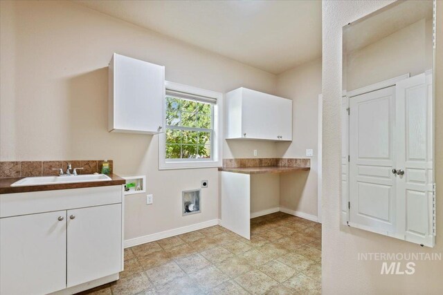 12970 N 9th Ave, Boise, ID 83714 - washroom featuring electric dryer hookup, cabinet space, baseboards, and washer hookup