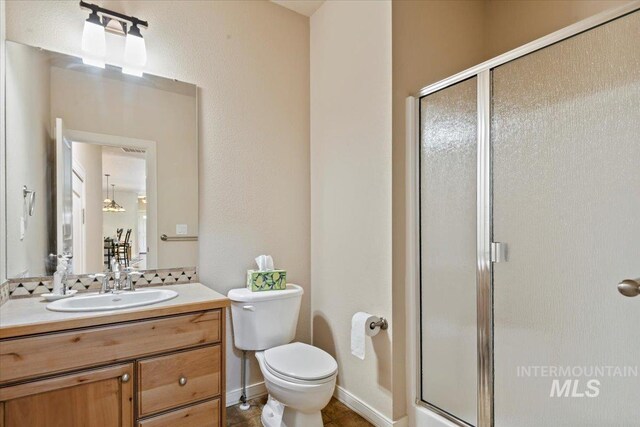 12970 N 9th Ave, Boise, ID 83714 - full bath featuring a shower stall, vanity, and toilet