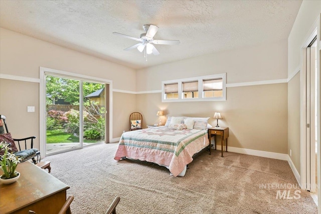 12970 N 9th Ave, Boise, ID 83714 - bedroom featuring access to exterior, carpet flooring, a textured ceiling, baseboards, and a ceiling fan