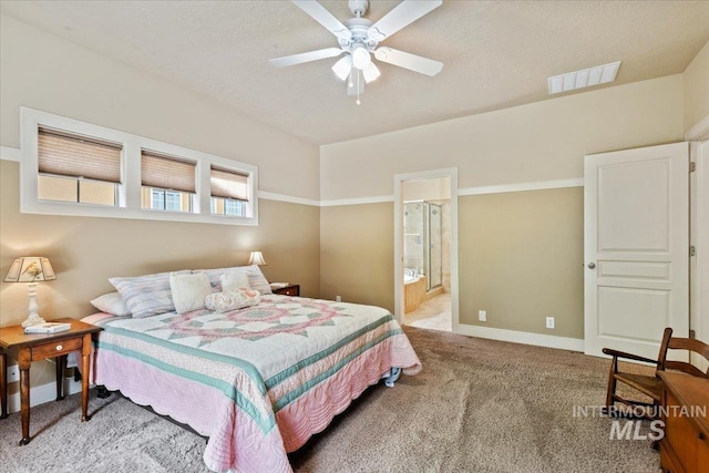12970 N 9th Ave, Boise, ID 83714 - bedroom featuring carpet, baseboards, connected bathroom, and a ceiling fan