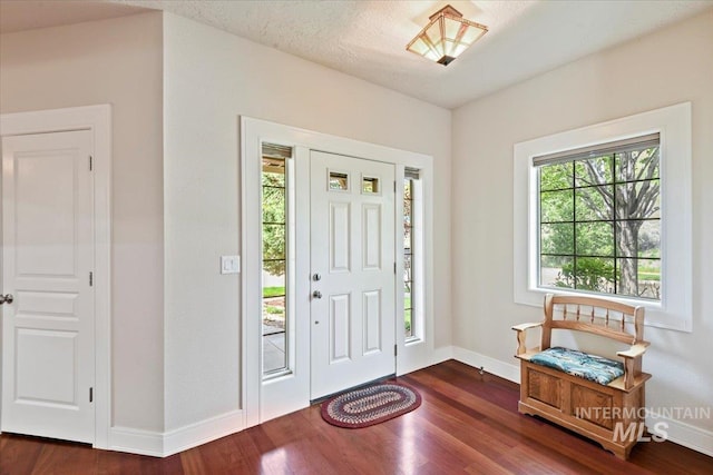 12970 N 9th Ave, Boise, ID 83714 - foyer entrance featuring dark wood-style floors and baseboards