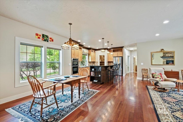 12970 N 9th Ave, Boise, ID 83714 - dining space featuring baseboards, dark wood-style flooring, a chandelier, and recessed lighting