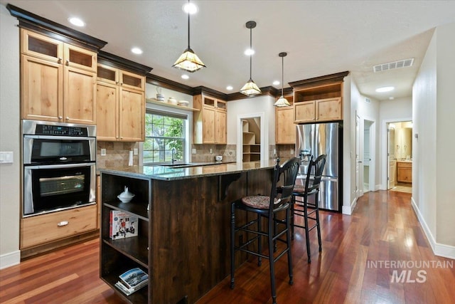 12970 N 9th Ave, Boise, ID 83714 - kitchen with appliances with stainless steel finishes, open shelves, a sink, a center island, and dark stone counters