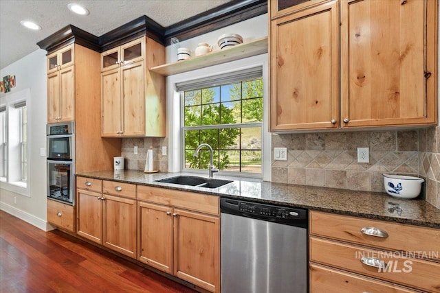 12970 N 9th Ave, Boise, ID 83714 - kitchen with appliances with stainless steel finishes, a sink, dark wood-style flooring, dark stone counters, and tasteful backsplash