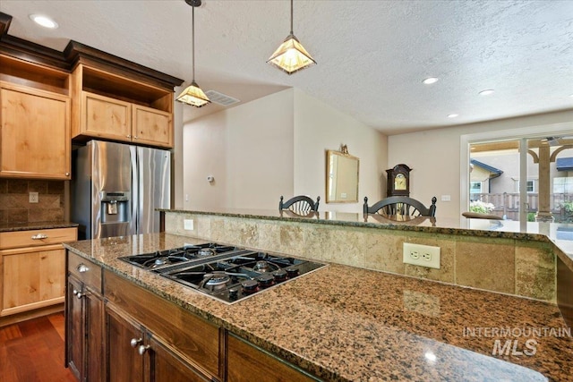 12970 N 9th Ave, Boise, ID 83714 - kitchen featuring stainless steel refrigerator with ice dispenser, black gas cooktop, dark wood-type flooring, a textured ceiling, and tasteful backsplash