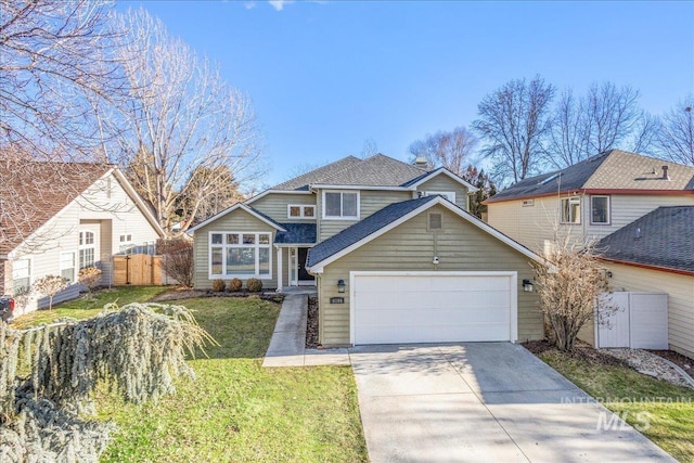 front of property with a front lawn and a garage