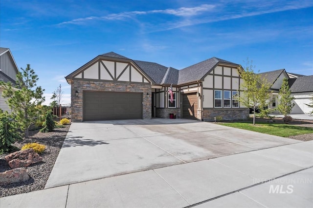 8237 W Corinthia St, Eagle, ID 83616 - tudor home with stone siding, a garage, driveway, and stucco siding