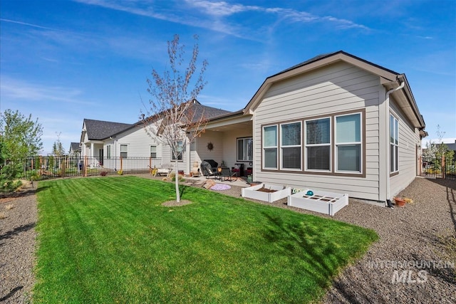 8237 W Corinthia St, Eagle, ID 83616 - back of house featuring a fenced backyard and a patio