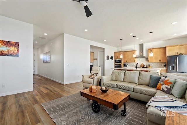 8237 W Corinthia St, Eagle, ID 83616 - living room with dark wood-style floors, ceiling fan, and recessed lighting