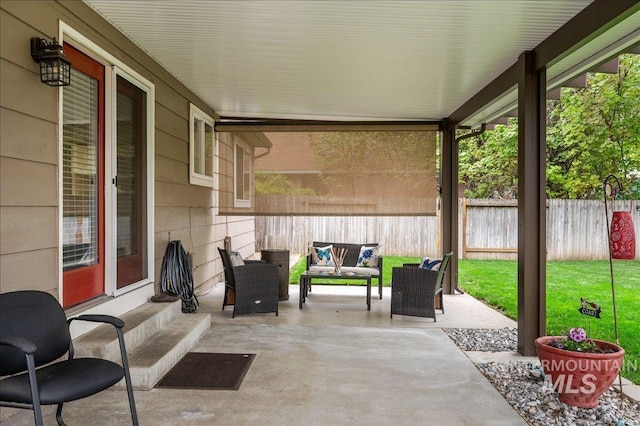 view of patio / terrace featuring entry steps and fence