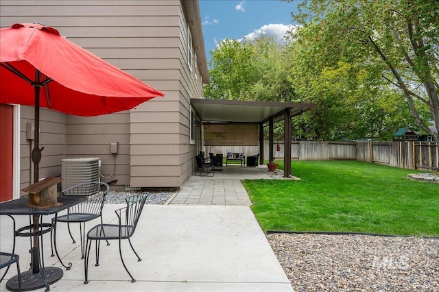 view of patio / terrace featuring central AC and a fenced backyard