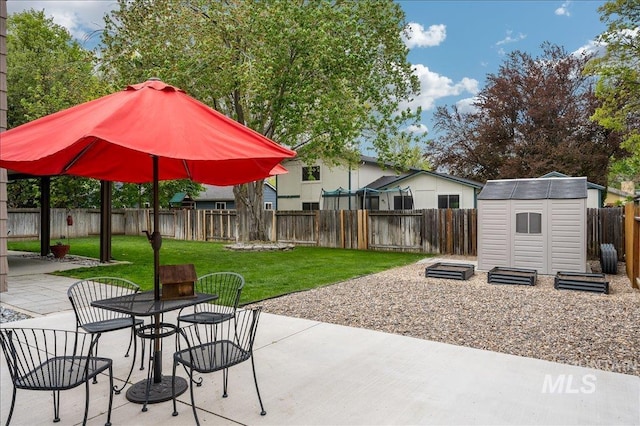 view of patio / terrace featuring a fenced backyard, an outdoor structure, and a shed