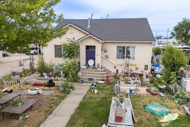 504 E Grove Ave, Parma, ID 83660 - bungalow featuring a garden and roof with shingles