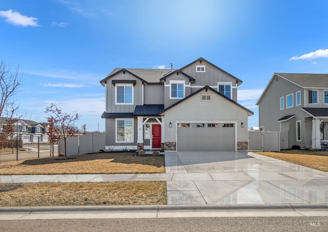 craftsman inspired home featuring a gate, fence, board and batten siding, and driveway