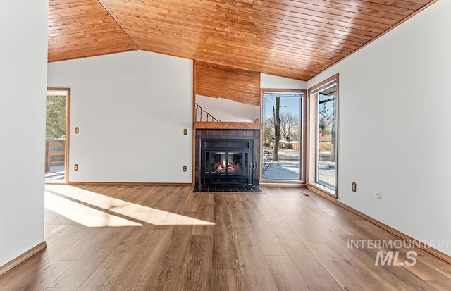 unfurnished living room featuring lofted ceiling, hardwood / wood-style floors, and wood ceiling