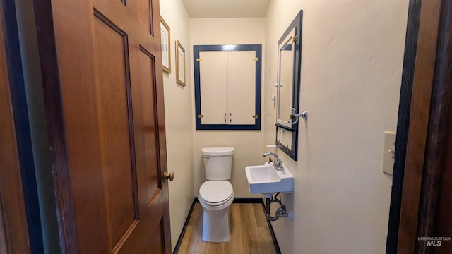 815 E 6th, Moscow, ID 83843 - bathroom featuring wood finished floors and toilet