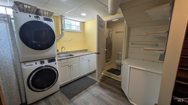 815 E 6th, Moscow, ID 83843 - washroom with stacked washer and clothes dryer, wood finished floors, and recessed lighting