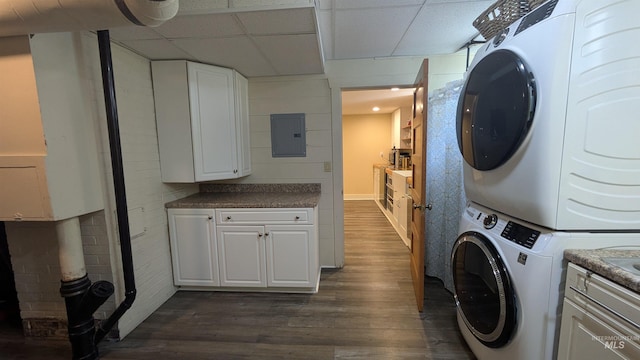 815 E 6th, Moscow, ID 83843 - laundry area featuring stacked washer / dryer, electric panel, and dark wood-style flooring