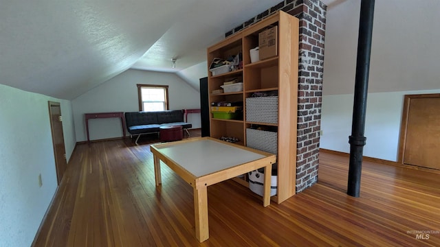 815 E 6th, Moscow, ID 83843 - playroom with vaulted ceiling and dark wood-style floors