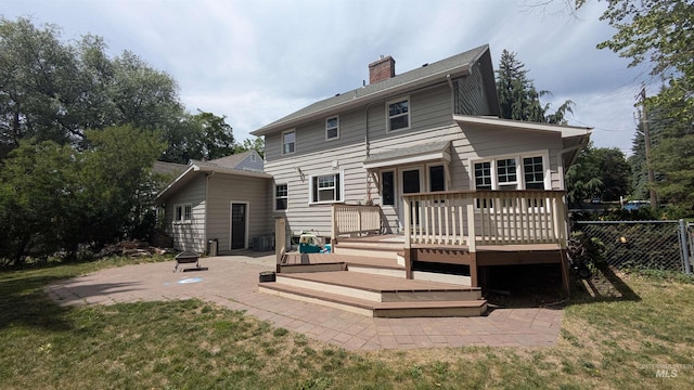 815 E 6th, Moscow, ID 83843 - rear view of house featuring an outdoor fire pit, a patio area, a wooden deck, and a chimney