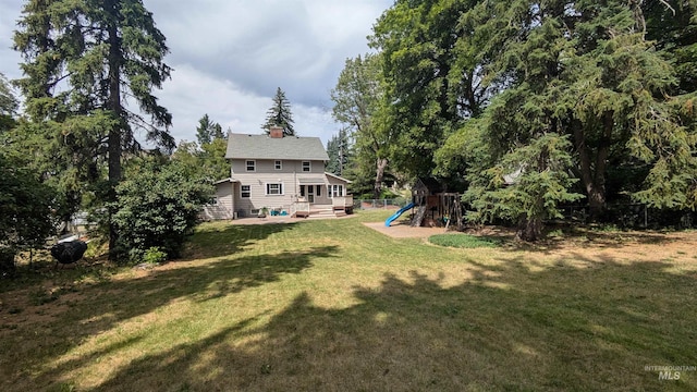 815 E 6th, Moscow, ID 83843 - view of yard with a playground and a deck