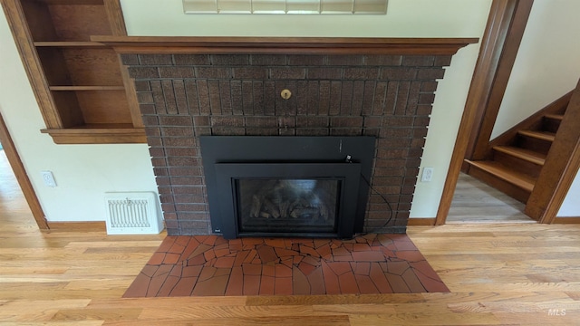 815 E 6th, Moscow, ID 83843 - detailed view of wood finished floors and a fireplace