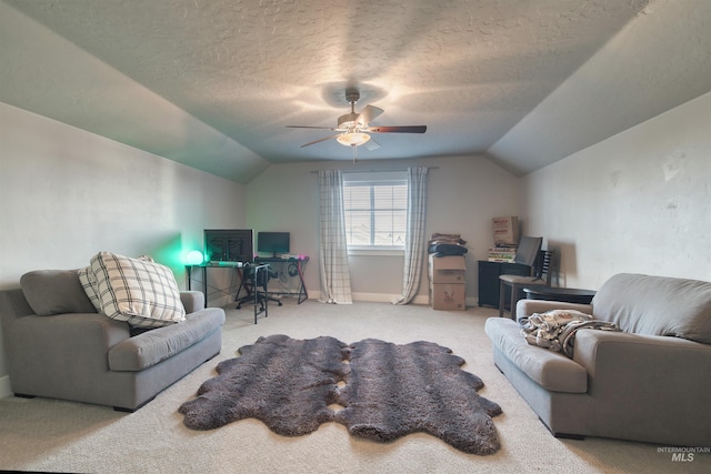 living area with carpet flooring, a ceiling fan, and lofted ceiling
