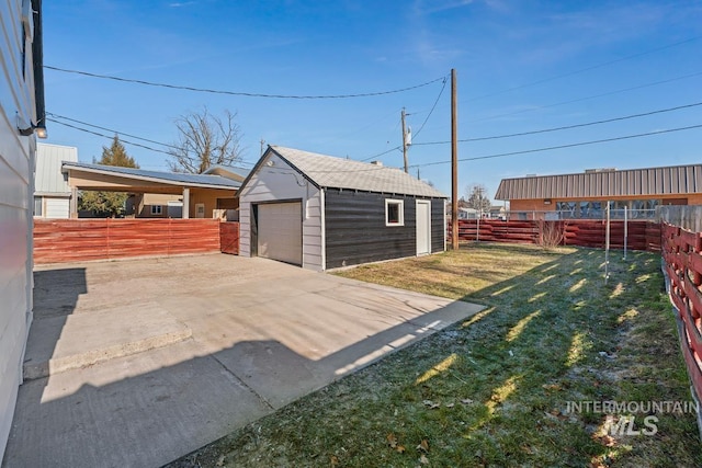 garage featuring a yard