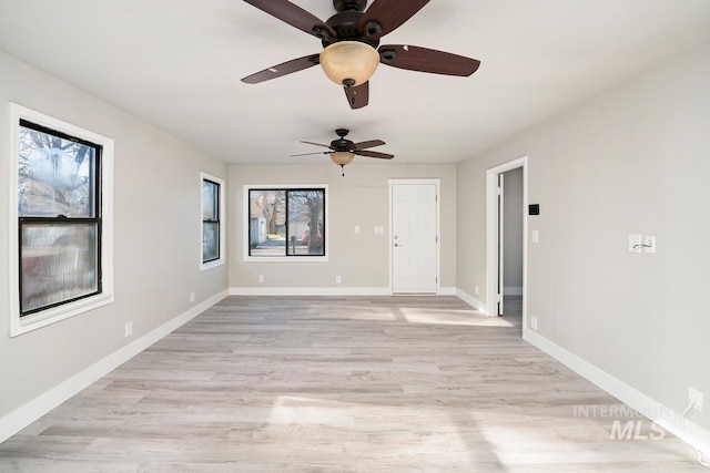 unfurnished room with ceiling fan and light hardwood / wood-style flooring