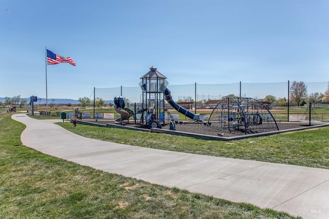 community jungle gym with a yard