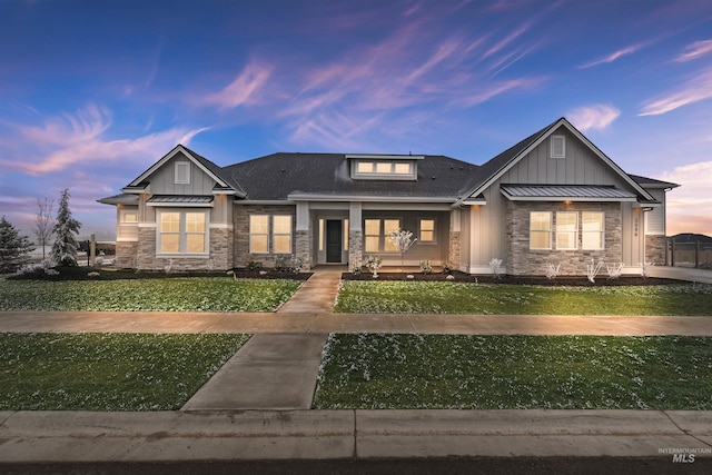 9424 Basin Kid, Middleton, ID 83644 - view of front facade featuring board and batten siding, a front yard, and stone siding