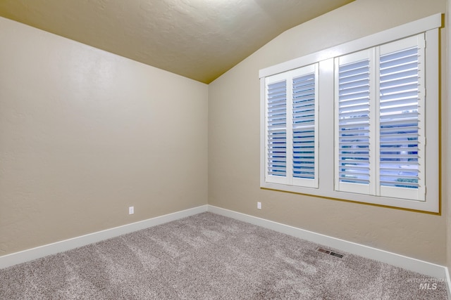 13569 Paoletti St, Caldwell, ID 83607 - unfurnished room with lofted ceiling and carpet floors