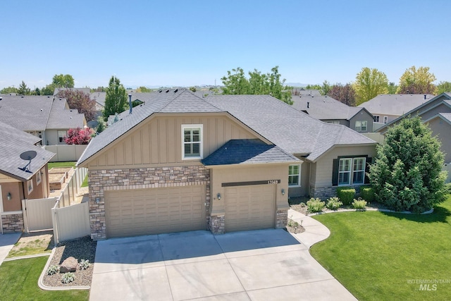 13569 Paoletti St, Caldwell, ID 83607 - view of front of house featuring board and batten siding, stone siding, concrete driveway, a shingled roof, and an attached garage
