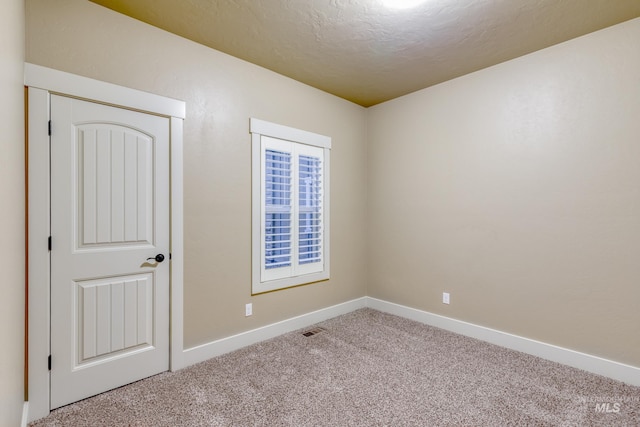 13569 Paoletti St, Caldwell, ID 83607 - carpeted spare room with baseboards and a textured ceiling