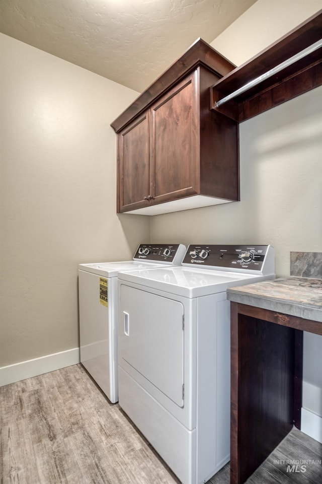 13569 Paoletti St, Caldwell, ID 83607 - laundry room with separate washer and dryer, cabinet space, and light wood-style flooring