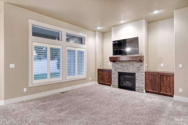 13569 Paoletti St, Caldwell, ID 83607 - unfurnished living room with carpet and a fireplace