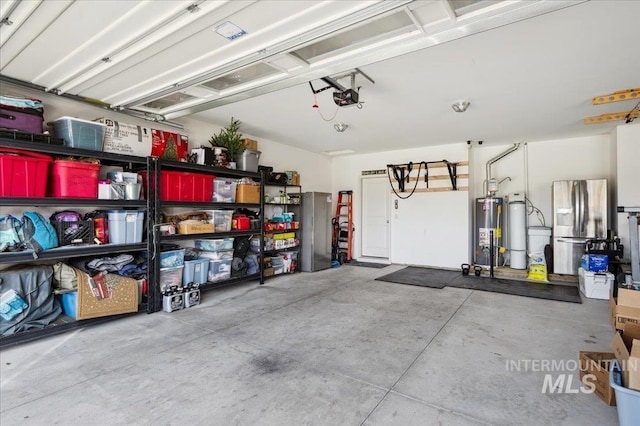 1046 N Warm River Ave, Kuna, ID 83634 - garage with a garage door opener, water heater, freestanding refrigerator, and stainless steel refrigerator with ice dispenser