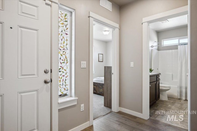 1046 N Warm River Ave, Kuna, ID 83634 - entryway featuring visible vents, baseboards, and wood finished floors