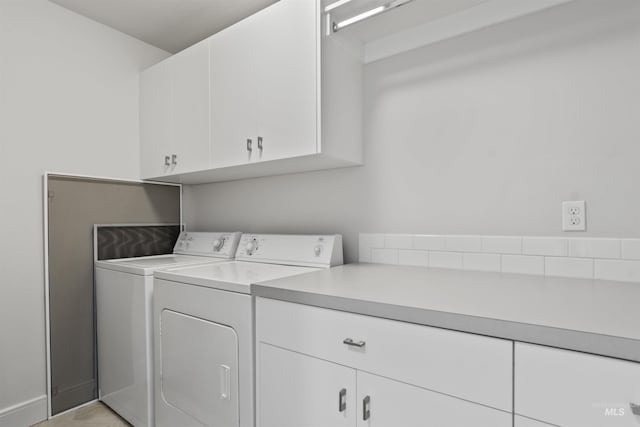 10110 Irongate Dr, Nampa, ID 83687 - clothes washing area featuring separate washer and dryer and cabinet space