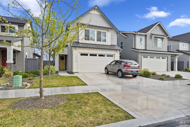 10110 Irongate Dr, Nampa, ID 83687 - traditional-style home with an attached garage, driveway, a standing seam roof, and fence