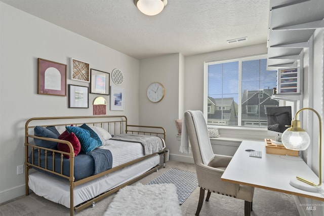 10110 Irongate Dr, Nampa, ID 83687 - bedroom with visible vents, baseboards, carpet floors, and a textured ceiling