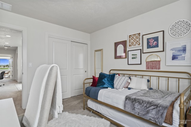 10110 Irongate Dr, Nampa, ID 83687 - bedroom featuring carpet flooring, a textured ceiling, visible vents, and a closet