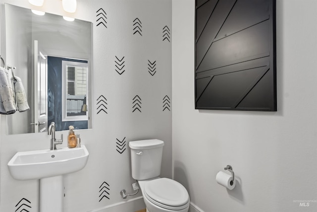 10110 Irongate Dr, Nampa, ID 83687 - bathroom featuring baseboards, a sink, and toilet