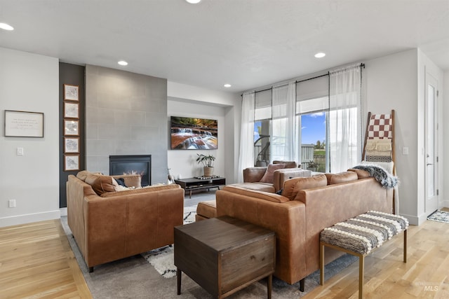 10110 Irongate Dr, Nampa, ID 83687 - living room with recessed lighting, light wood-type flooring, a fireplace, and baseboards