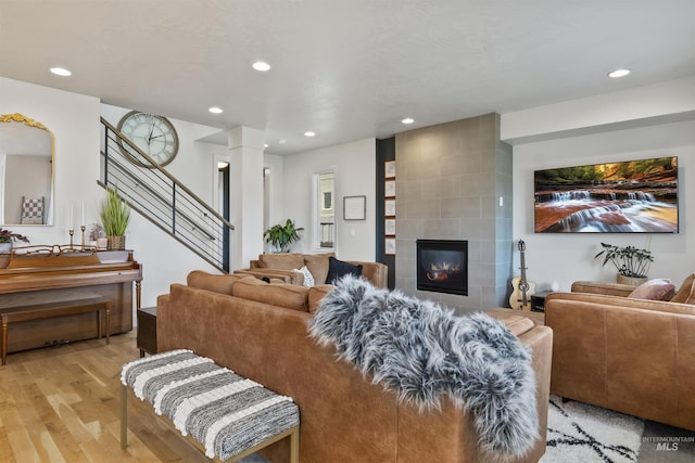10110 Irongate Dr, Nampa, ID 83687 - living room featuring recessed lighting, light wood finished floors, and stairs