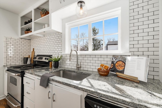 kitchen with electric range, a sink, open shelves, tasteful backsplash, and white cabinetry