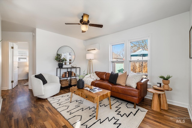 living area featuring a ceiling fan, wood finished floors, baseboards, and a wall mounted AC