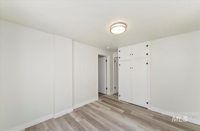 116 S Nectarine St, Nampa, ID 83686 - unfurnished bedroom with light wood-style flooring and a closet