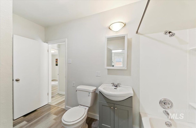 116 S Nectarine St, Nampa, ID 83686 - bathroom with wood finished floors, vanity, and washtub / shower combination
